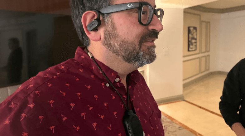 Stein tests prototype pendant-to-earbuds audio streaming. Signal cuts off centimeters from body, reconnects instantly.