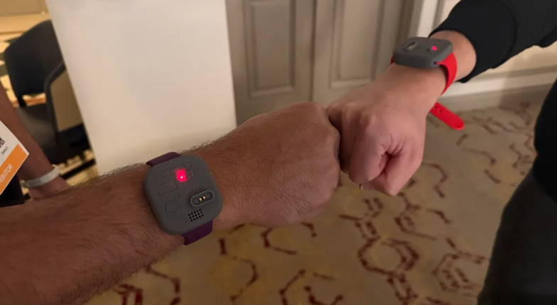 Fist-bumping data between wearables: The demo showed information transferring from one device to another as soon as both hands came into close range.